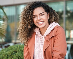 Smiling woman sitting outside