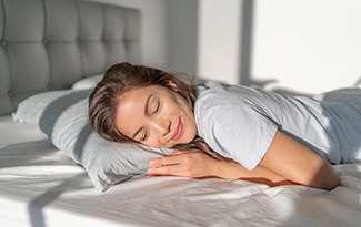 Woman sleeping peacefully in bed