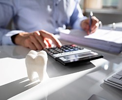 dentist calculating the cost of cosmetic dentistry in Lincoln 