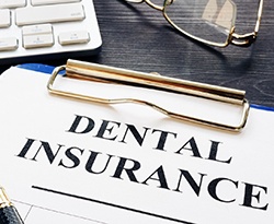 Insurance paperwork for the cost of dental implants in Lincoln
