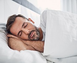 Man sleeping in bed