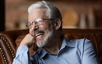 Man laughing with dentures