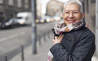 Woman smiling with dentures in Lincoln