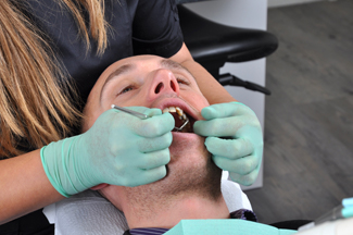 Man having tooth extracted