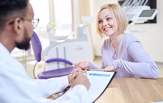 a patient discussing the cost of tooth extractions