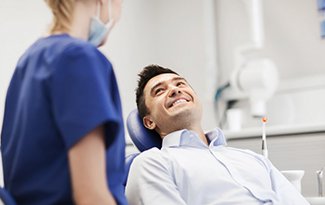 a patient smiling at his dentist