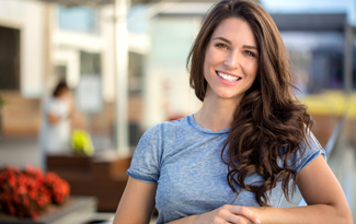 woman smiling on a patio