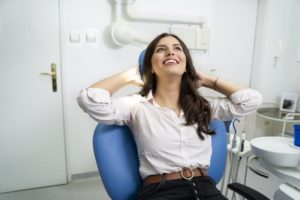 Woman smiling with dental implants in Lincoln