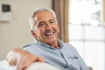 person smiling after transitioning to dental implants