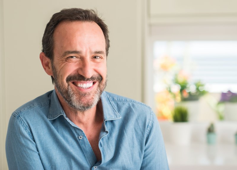 Man wearing dentures smiling